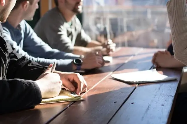 consultants in a meeting with sun shining through